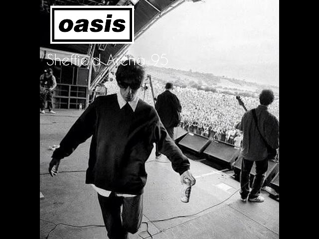 Oasis live performance at Sheffield Arena 1995, featuring Liam Gallagher on stage with a crowd in the background.